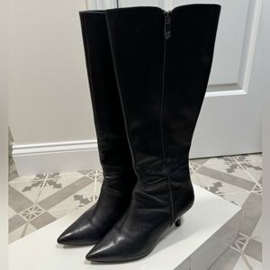 Beautiful black leather calf boots with a small heel.